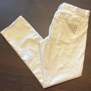 White jeans with studded back pockets